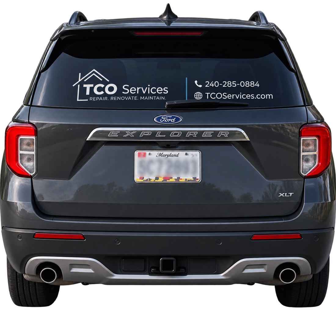 Rear-window vinyl on the TCO Services vehicle showing the logo, phone number and web address.